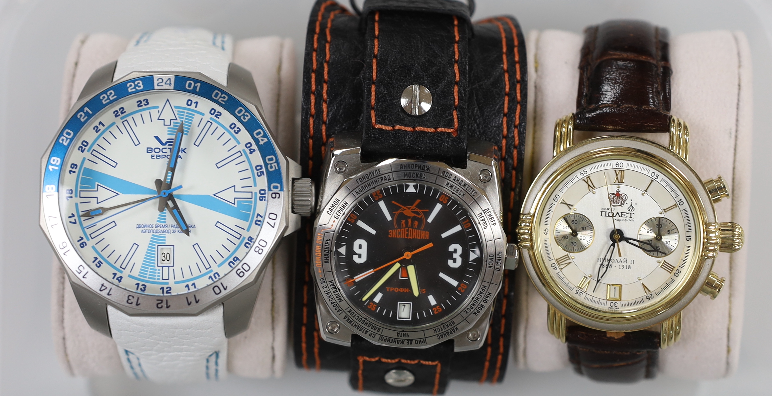 Three gentleman's modern stainless steel wrist watches including Vostok Europe and two other Russian watches.